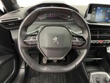 the interior of a car with a steering wheel and dashboard controls
