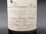 a close up of a bottle of wine on a table