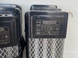 two old radio ' s sitting next to each other on the wall