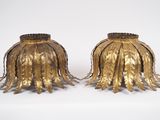 pair of antique brass candlesticks with fringes on each end