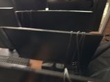 a man sitting in a chair with a laptop on his lap