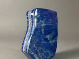 a large blue stone with a thin line of blue veining on it