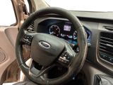 a steering wheel and dashboard of a car in a car showroom