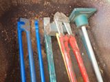a lot of tools that are laying on the ground
