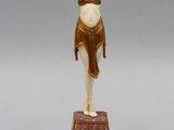 an art deco figurine of a woman in a bathing suit