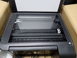a printer that is sitting in a box on the floor
