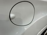 a close up of a car door handle with a hole in it