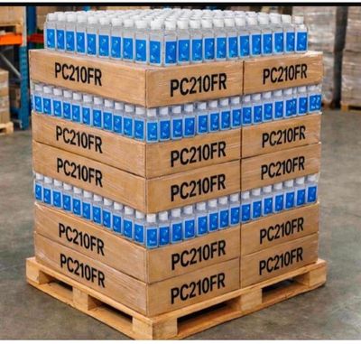 boxes of water are stacked on a pallet in a warehouse