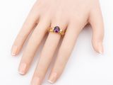 an image of a woman ' s hand with a ring on it