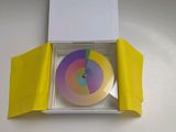 a box with a cd inside of it on a table