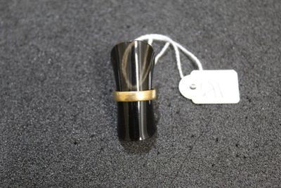 a ring that is sitting on top of a black object