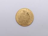an image of a gold coin on a white surface