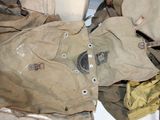 a pile of old military clothing on the floor