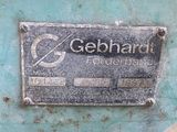 a close up of a metal sign on a blue surface