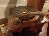 a record player sitting on top of a wooden table