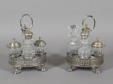 pair of silver plated and cut glass decanters on stands