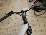 a close up of a bicycle handlebar on a tiled floor