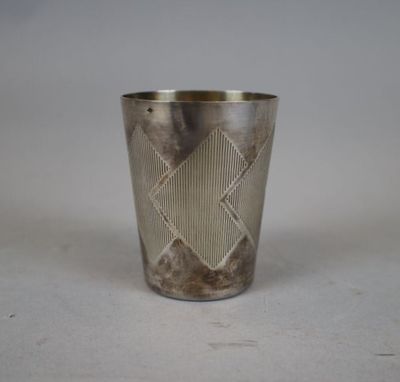 an image of a silver cup with a diamond design on it