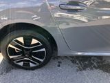 a close up of a car ' s wheel on the street