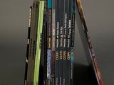 books stacked on top of each other with a pencil sticking out of them