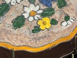 a plate with flowers on it sitting on a table