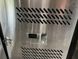 a stainless steel box with a button on it