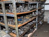 a room with a lot of metal items on the shelves