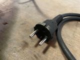 a black cord that is connected to a black plug