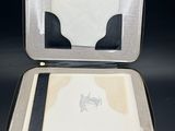 a black and white case with a notepad inside