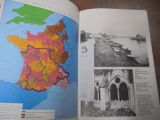 un livre ouvert sur lequel figure une carte de la France