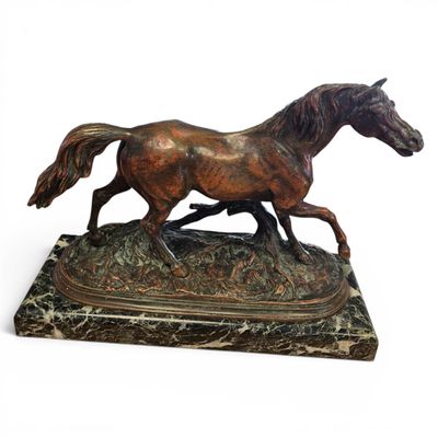 bronze statue of a horse running on a marble base