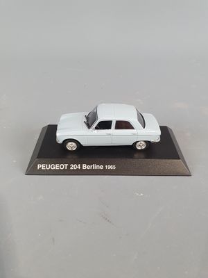 a white model of a car on display on a table