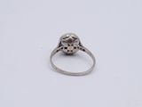an image of a ring with a flower design on it