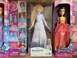 three barbie princess dolls are in their boxes on a table