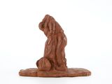 chocolate figurine of a man kneeling down with a soccer ball in his hand