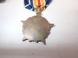 a medal with a star on it on a table