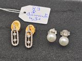 two pairs of pearl and diamond earrings and a tag with a price tag