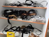 many pairs of sandals on the shelves in the store