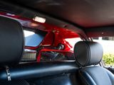 the interior of a car with black leather seats and red trims
