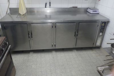 a large stainless steel counter in a commercial kitchen