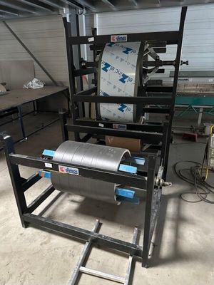 a machine that has a roll of paper on it