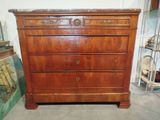 an antique chest of drawers in a room with a painting on the wall