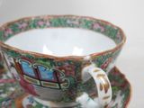 a cup and saucer on a saucer on a table