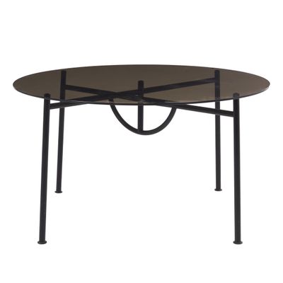 une table noire avec un plateau en verre et des pieds en métal