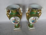 two vases that have been painted with flowers on them
