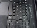 a laptop with a black keyboard sitting on a table
