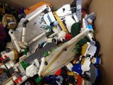 a box full of legos and other toys in it