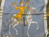 an image of a scarf with a man on a horse on it