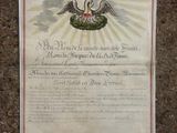 an old document with a cross on it sitting on the ground