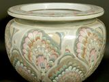 a large vase with a lid sitting on a table